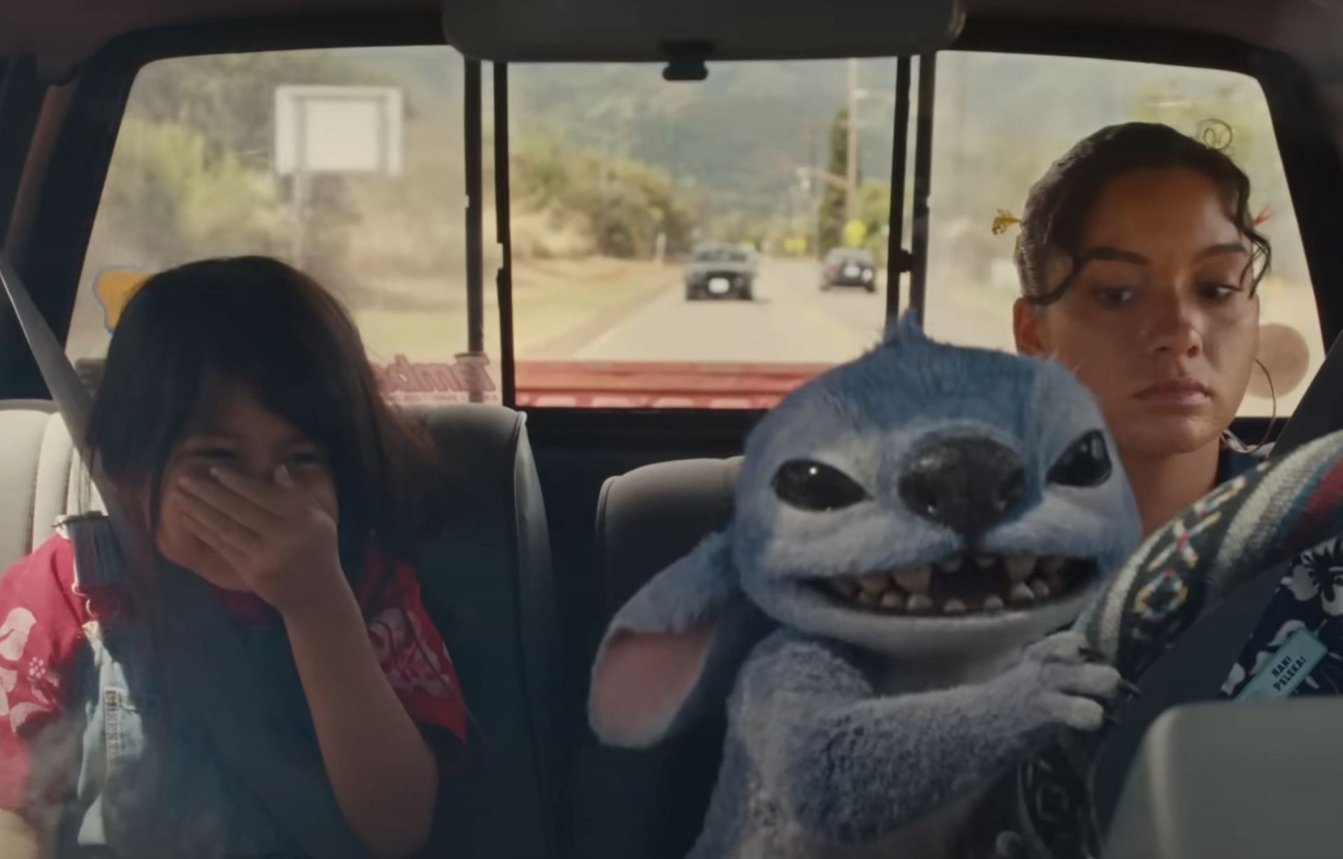 Lilo, Stitch, and Nani in Lilo & Stitch (Image via YouTube/Disney)